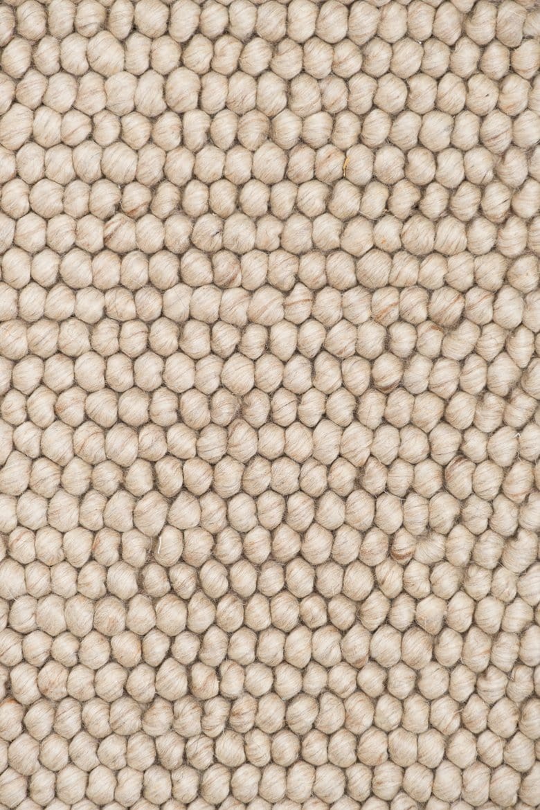 Kyra – Handwoven Braided Wool Rug in Warm Beige & Ivory